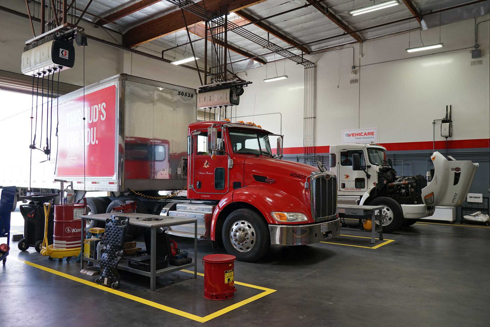 Vehicare trucks in shop bays